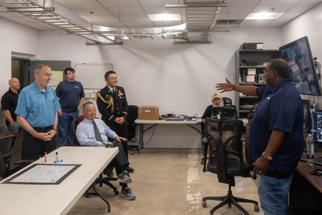 Distinguished visitors learn about infantry immersion training on Marine Corps Base Camp Lejeune, Aug. 6, 2025. The Japan U.S. Military Program connects U.S. service members, families and civilians who have served in Japan through a partnership between Sasakawa Peace Foundation USA, the Embassy of Japan and the National Association of Japan-America Societies. (U.S. Marine Corps photo by Lance Cpl. Erica S. Padgett)