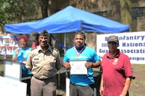 Maj. Gen. Rodney Boyd joins members in presenting a scholarship to Josiah Ruffin