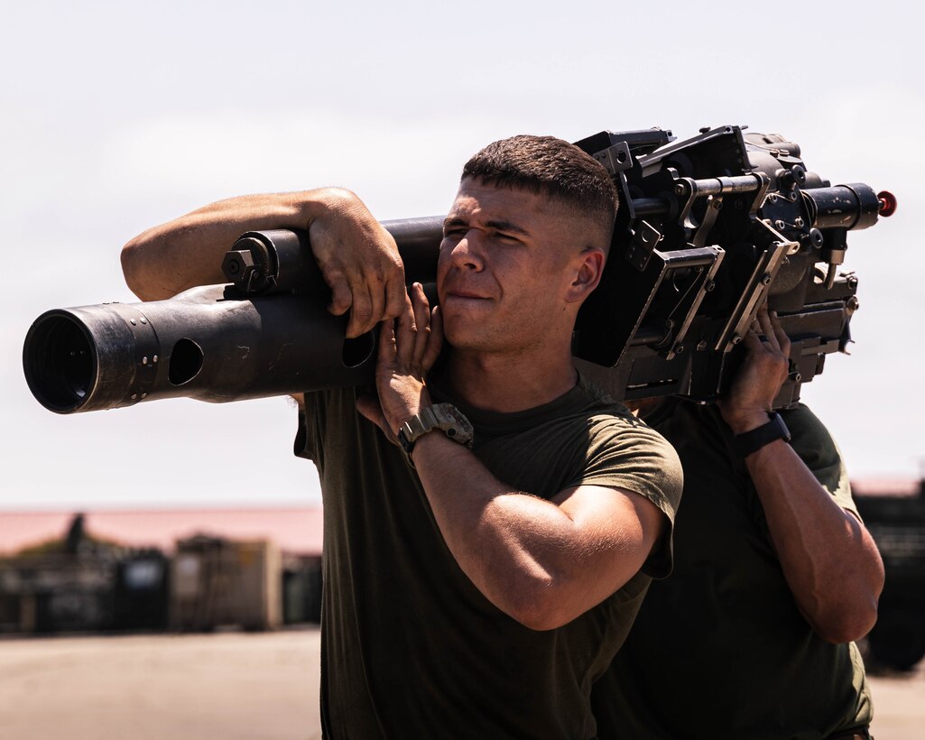 U.S. Marines with 1st Light Armored Reconnaissance Battalion, 1st Marine Division, I Marine Expeditionary Force, carry equipment during a joint limited technical inspection at Marine Corps Base Camp Pendleton, California, Aug. 11, 2025. The JLTI was performed to ensure the equipment is complete, safe to operate and capable of performing its designated primary combat function during future operations. (U.S. Marine Corps photo by Lance Cpl. Luke Rodriguez)