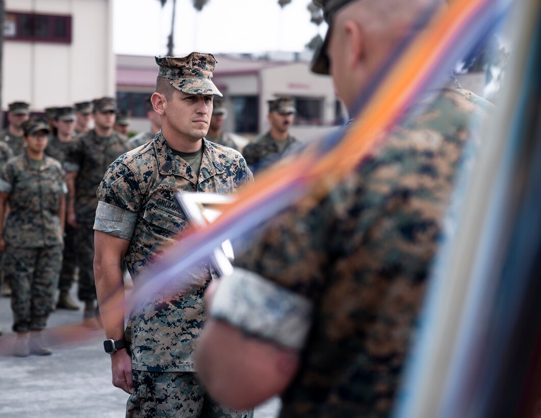 U.S. Marine Corps Master Sgt. Jeremy Grummer, assistant operations chief of the 11th Marine Expeditionary Unit, I Marine Expeditionary Force, is read his promotion warrant to the rank of master gunnery sergeant during a frocking ceremony at Marine Corps Base Camp Pendleton, California, Aug. 8, 2025. Frocking is a tradition where Marines are advanced to the next pay grade, assuming the title and responsibilities prior to their official date of promotion.  (U.S. Marine Corps photo by Cpl. Joseph Helms)