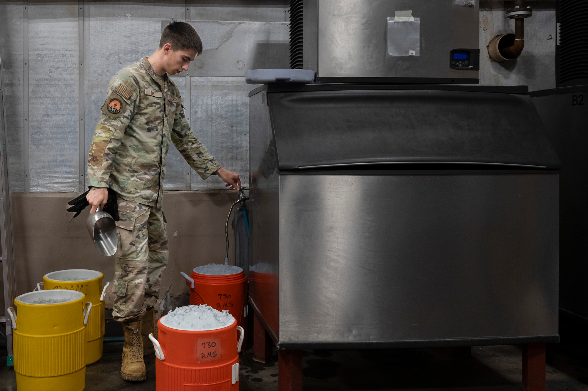 U.S. Air Force Senior Airman David Day, 730th Air Mobility Squadron passenger services representative, fills water igloos for aircrew in support of Resolute Force Pacific 2025 at Yokota Air Base, Japan, July 25, 2025. The 730th AMS Fleet Services team ensures military and commercial aircraft are mission-ready by stocking essential supplies, removing waste, and servicing lavatories. REFORPAC is part of the first-in-a-generation Department-Level Exercise series, a new way of conducting operations in a contested, dynamic environment to build capabilities making a stronger, more deterrent force. The DLE encompasses all branches of the Department of Defense, Allies, and partners, employing over 400 joint and coalition aircraft and more than 12,000 personnel across more than 50 locations spanning 3,000 miles. (U.S. Air Force photo by Airman 1st Class Samantha Thorn)