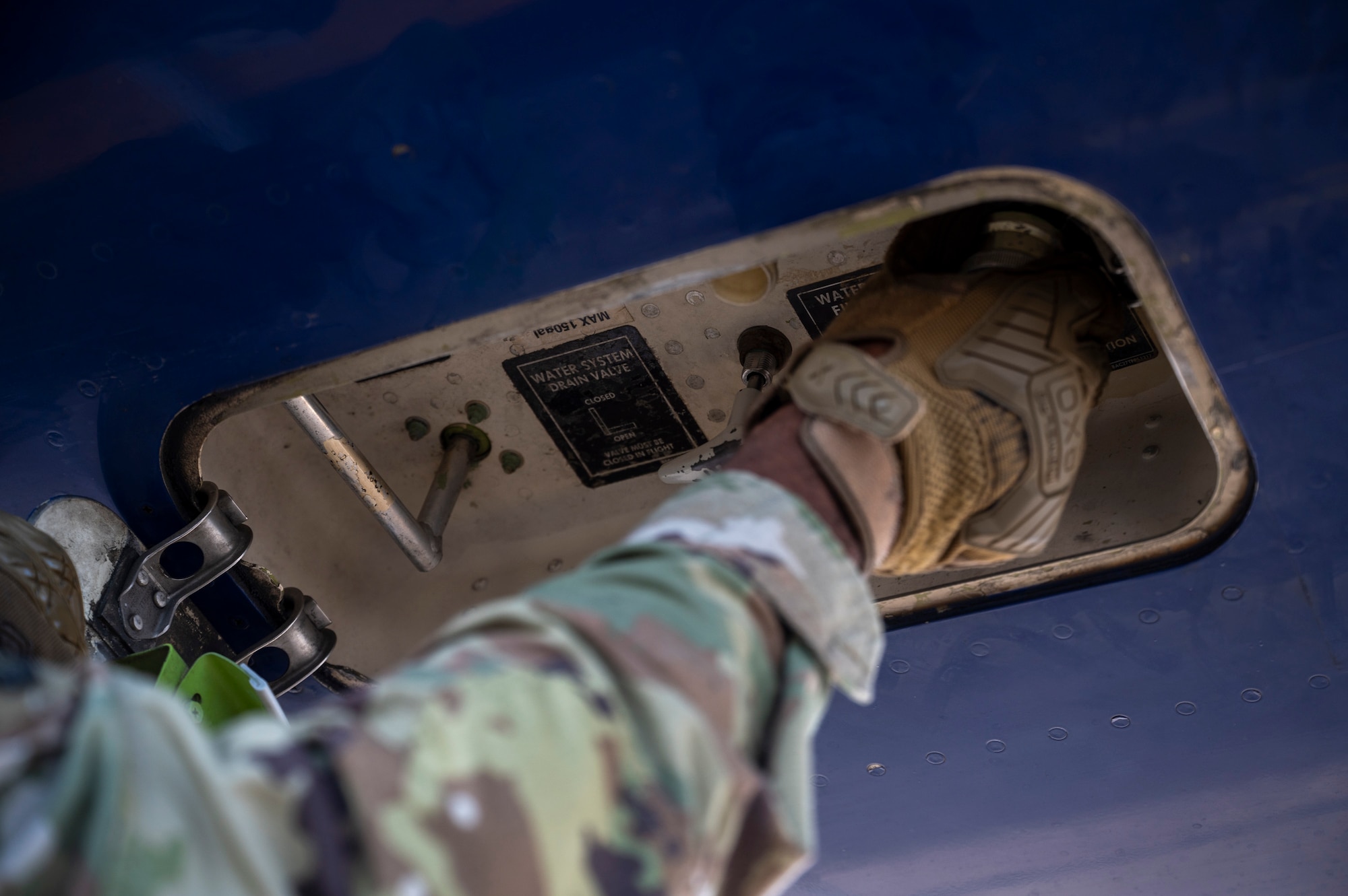 U.S. Air Force Senior Airman Tyric McBean, 730th Air Mobility Squadron air transportation specialist, provides potable water to a Boeing 767 passenger aircraft in support of Resolute Force Pacific 2025 at Yokota Air Base, Japan, July 24, 2025. The 730th AMS Fleet Services team ensures all military and commercial aircraft are fully functional and ready for departure. REFORPAC is part of the first-in-a-generation Department-Level Exercise series, a new way of conducting operations in a contested, dynamic environment to build capabilities making a stronger, more deterrent force. The DLE encompasses all branches of the Department of Defense, Allies, and partners, employing over 400 joint and coalition aircraft and more than 12,000 personnel across more than 50 locations spanning 3,000 miles. (U.S. Air Force photo by Airman 1st Class Samantha Thorn)