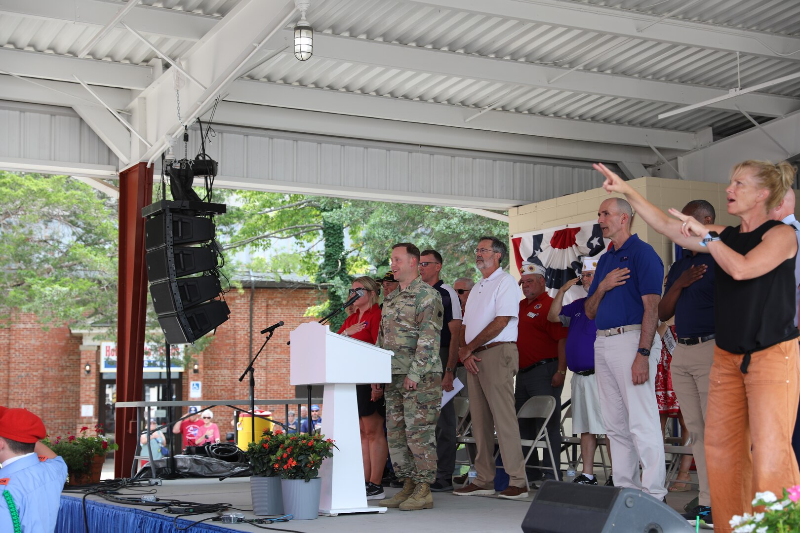 Staff Sgt. Jeremy Weaver sings the National Anthem
