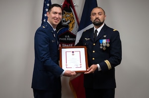 A french soldier presents an award to a U.S. Space Force Soldier.