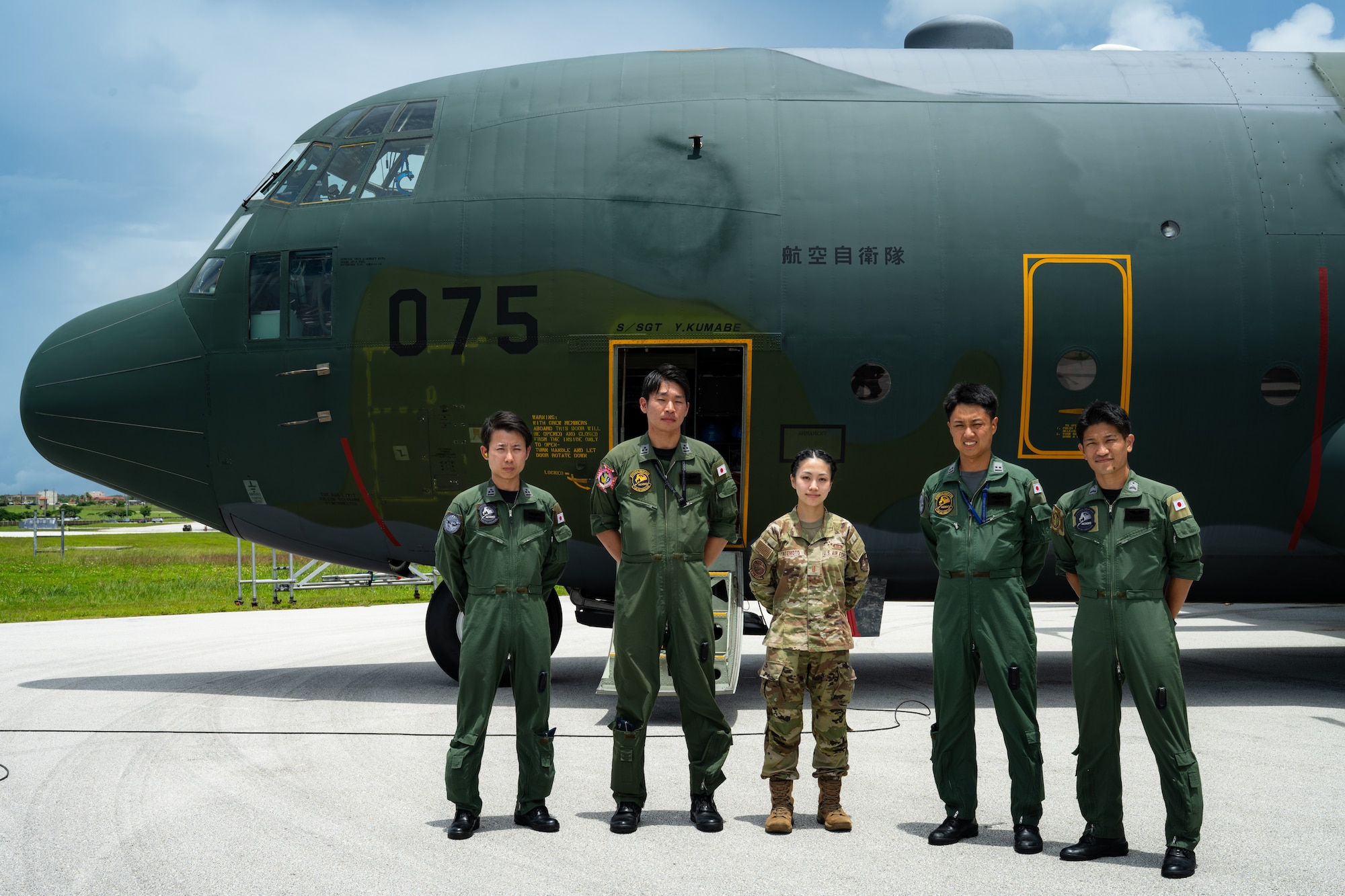 Japan Air Self-Defense Force service members pose with U.S. Air Force 2nd Lt. Julie Tatemoto, 51st Operations Support Squadron airfield operations director of operations and Language Enabled Airman Program participant, Osan Air Base, South Korea, during the U.S. Air Force’s 2025 Department-Level Exercise series at Andersen Air Force Base, Guam, July 22, 2025. LEAP empowers the DLE by enhancing linguistic and cultural interoperability, enabling more effective collaboration and mission success with partners and allies. DLE 2025 is a new way of conducting operations in a contested, dynamic environment to build capabilities, making a stronger, more deterrent force. The DLE encompasses all branches of the Department of Defense, along with Allies and partners, employing more than 400 Joint and coalition aircraft and more than 12,000 members at more than 50 locations across 3,000 miles. (U.S. Air Force photo by Senior Airman Jade M. Caldwell)