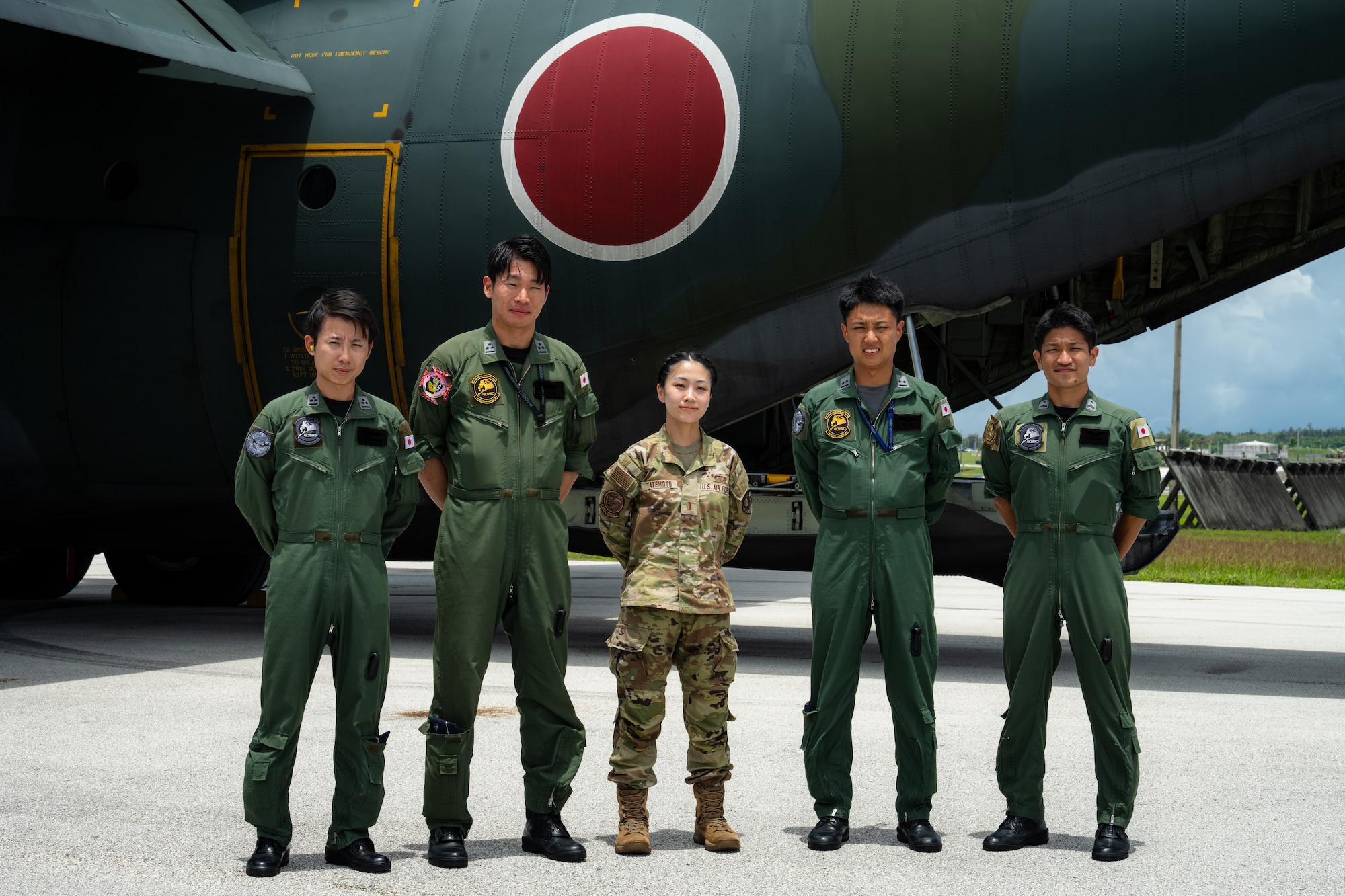 Japan Air Self-Defense Force service members pose with U.S. Air Force 2nd Lt. Julie Tatemoto and Language Enabled Airman Program participant, 51st Operations Support Squadron airfield operations director of operations, Osan Air Base, South Korea, during the U.S. Air Force’s 2025 Department-Level Exercise series at Andersen Air Force Base, Guam, July 22, 2025. LEAP empowers the DLE by enhancing linguistic and cultural interoperability, enabling more effective collaboration and mission success with partners and allies. DLE 2025 is a new way of conducting operations in a contested, dynamic environment to build capabilities, making a stronger, more deterrent force. The DLE encompasses all branches of the Department of Defense, along with Allies and partners, employing more than 400 Joint and coalition aircraft and more than 12,000 members at more than 50 locations across 3,000 miles. (U.S. Air Force photo by Senior Airman Jade M. Caldwell)