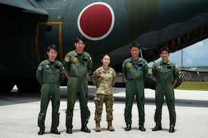 Japan Air Self-Defense Force service members pose with U.S. Air Force 2nd Lt. Julie Tatemoto and Language Enabled Airman Program participant, 51st Operations Support Squadron airfield operations director of operations, Osan Air Base, South Korea, during the U.S. Air Force’s 2025 Department-Level Exercise series at Andersen Air Force Base, Guam, July 22, 2025. LEAP empowers the DLE by enhancing linguistic and cultural interoperability, enabling more effective collaboration and mission success with partners and allies. DLE 2025 is a new way of conducting operations in a contested, dynamic environment to build capabilities, making a stronger, more deterrent force. The DLE encompasses all branches of the Department of Defense, along with Allies and partners, employing more than 400 Joint and coalition aircraft and more than 12,000 members at more than 50 locations across 3,000 miles. (U.S. Air Force photo by Senior Airman Jade M. Caldwell)