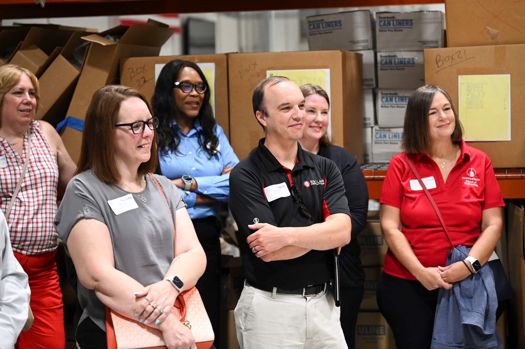 Members of the Miami Valley Higher Education Consortium look forward with positive expressions.