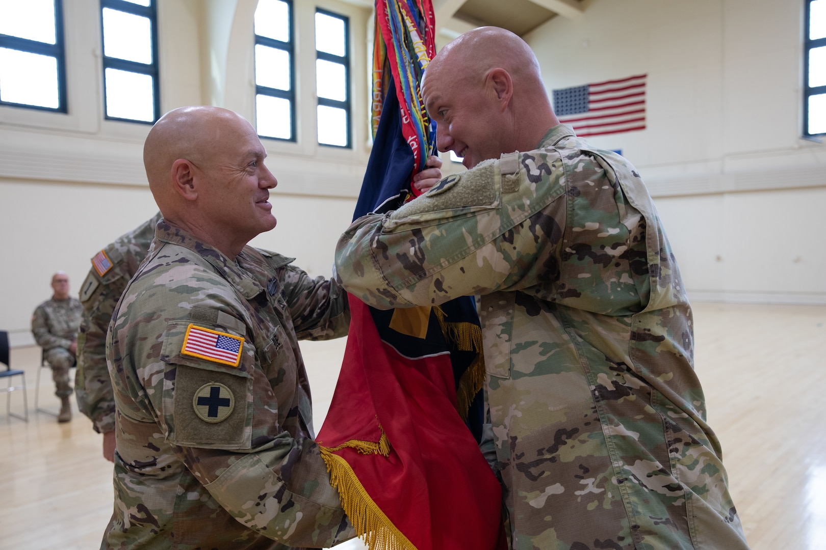 Command Sgt. Maj. Filipiak passes colors to Col. Hible, Aug. 17, 2025.