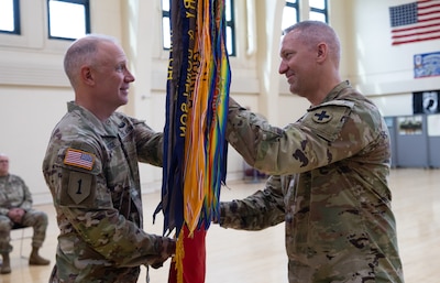 Brig. Gen. Eastridge passes colors to Col. Kowalski, Aug. 17, 2025.