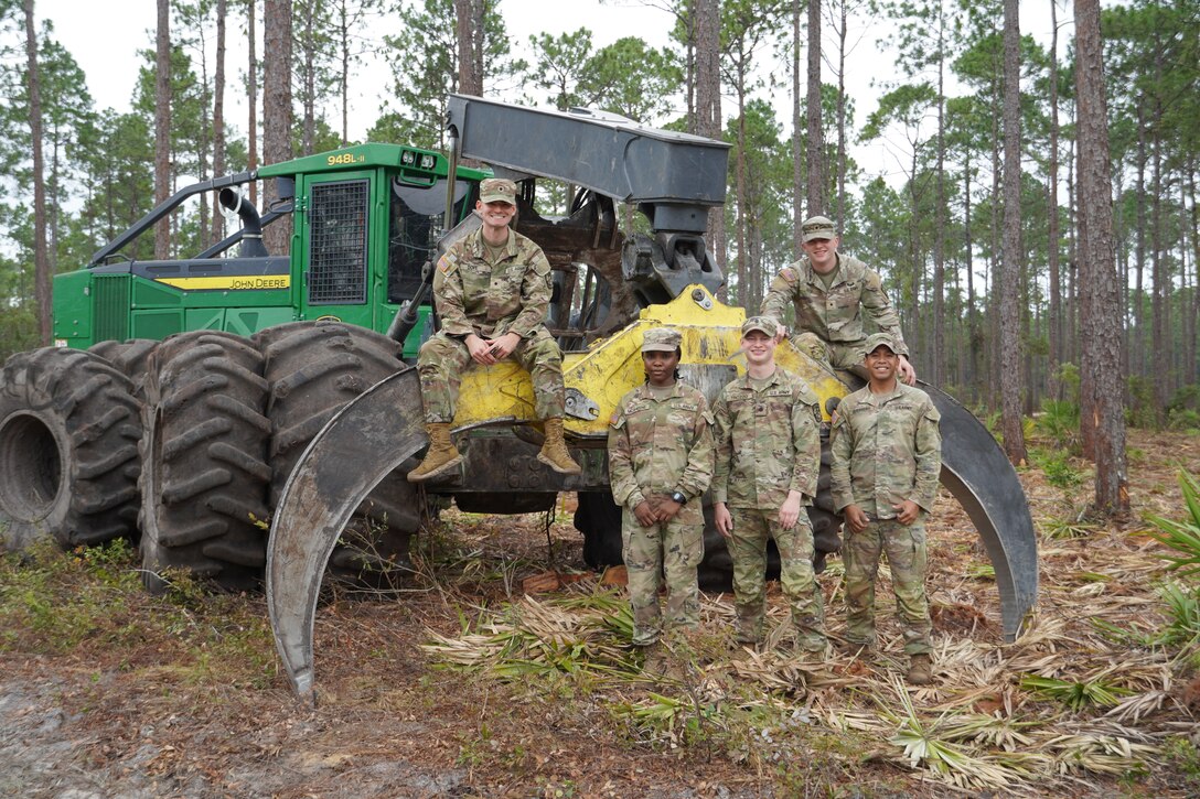 Army Reserve Officers’ Training Corps cadets pose for a photo with a grapple skidder during a forestry management tour at Fort Stewart, Georgia, Aug. 8, 2025. The Cadets are assigned to the U.S. Army Corps of Engineers, Savannah District for their summer internship.