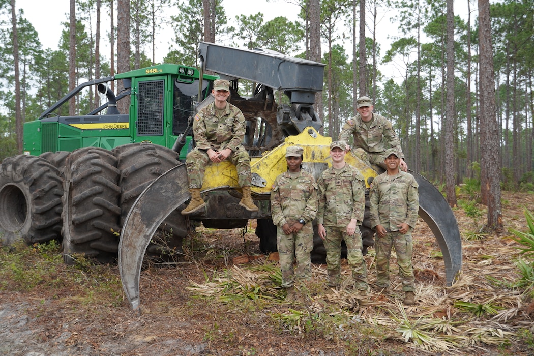 Army Reserve Officers’ Training Corps cadets pose for a photo with a grapple skidder during a forestry management tour at Fort Stewart, Georgia, Aug. 8, 2025. The Cadets are assigned to the U.S. Army Corps of Engineers, Savannah District for their summer internship.