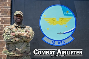 A man in uniform poses for a photo.
