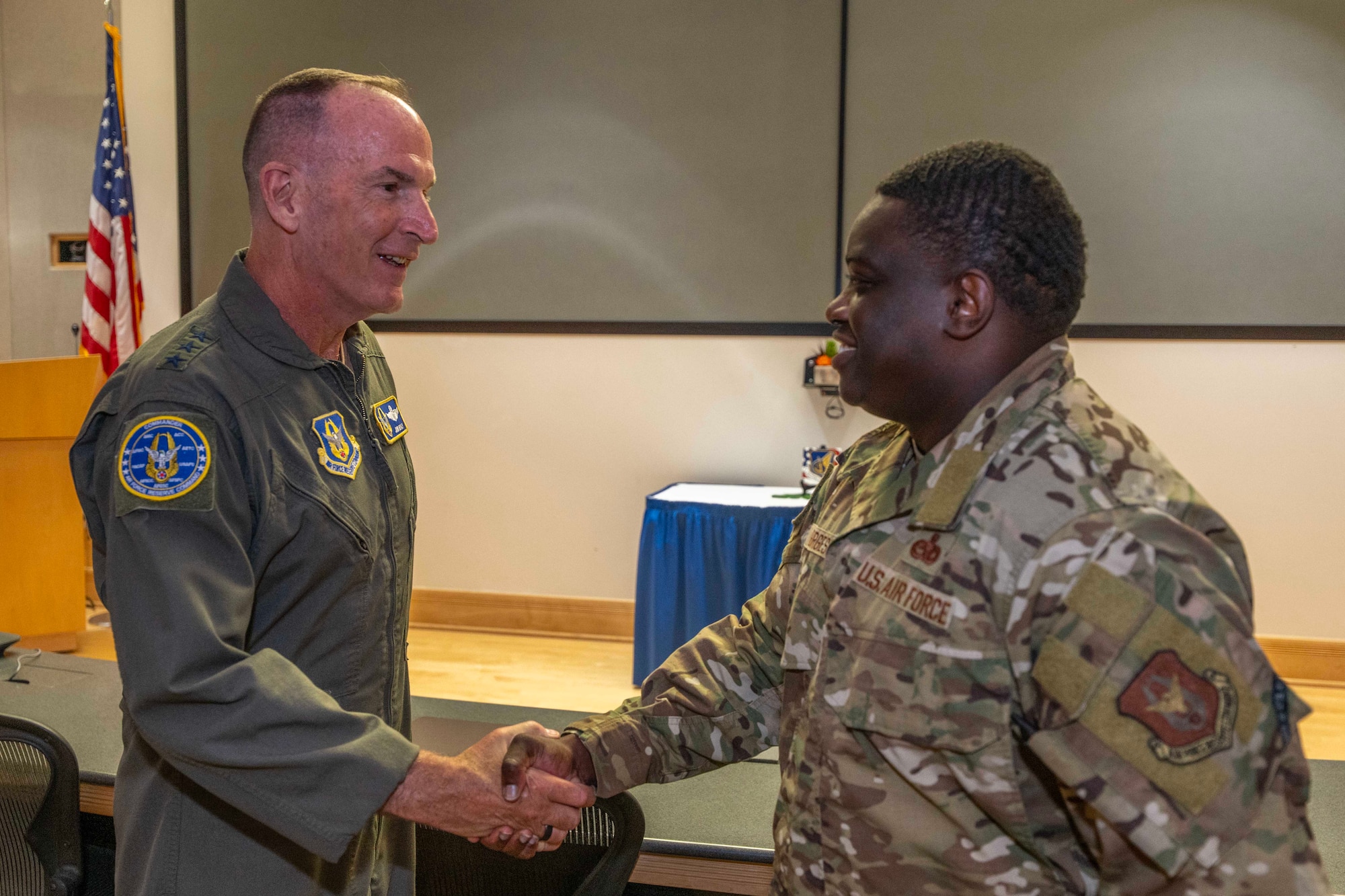 On August 14, Lt. Gen. John P. Healy, chief of the Air Force Reserve and commander of Air Force Reserve Command recognizes Senior Master Sgt. Derric Burgess, 624th Regional Support Group superintendent of logistics plans for his outstanding performance while at Joint Base Pearl Harbor-Hickam, Hawaii.