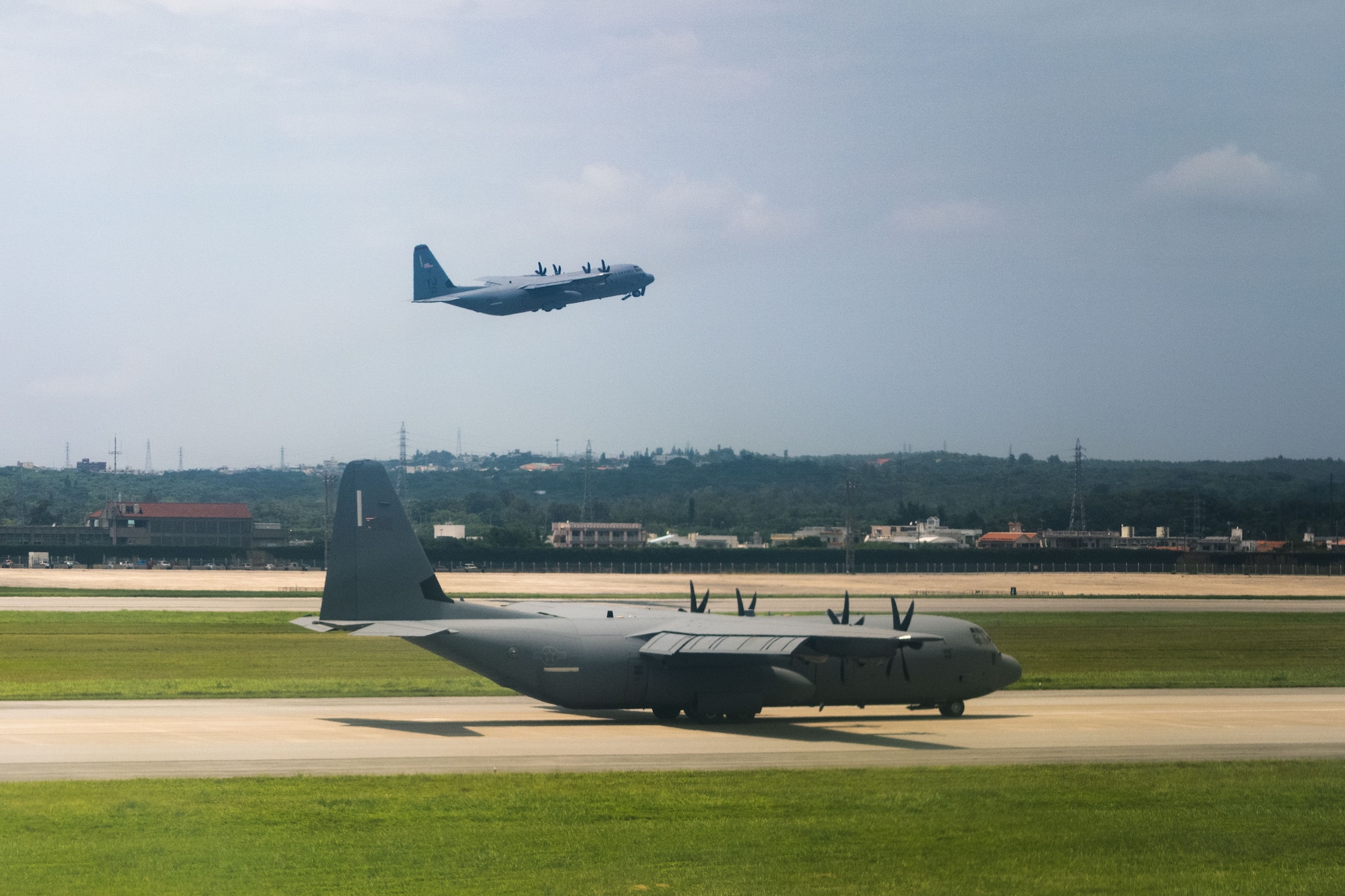C-130J Super Hercules aircraft assigned to the 374th Airlift Wing, depart Kadena Air Base, Japan, July 16, 2025. During local training in the region, Air Mobility Command aircraft enabled combined operations with joint and allied partners. AMC delivers rapid global mobility through airlift and air refueling operations, ensuring U.S. and allied forces can project power and respond swiftly anywhere in the world. (U.S. Air Force photo by Senior Airman Zachary Foster)