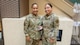 U.S. Air Force Airman 1st Class Nicole Leon- Perez, a medical technician with the 5th Medical Group on Minot Air Force Base, North Dakota, received a coin from U.S. Air Force Chief Master Sgt. Tanya Johnson, Defense Health Agency senior enlisted leader, during an Aug.13, 2025 visit.
