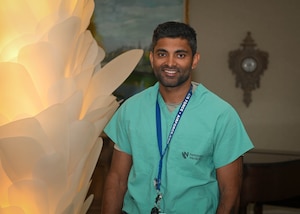 Lt. Col. Reynold Henry, 55th Medical Group trauma surgeon, who was embedded with the University of Nebraska Medical Center in Omaha, Nebraska, is pictured in his scrubs during a shift at UNMC in Omaha, Nebraska, July 11, 2025. Henry advocated for a program where prehospital whole blood transfusions have been adapted into local medical emergency practices, which provides an additional lifesaving measure for paramedics. (U.S. Air Force photo by Daniel Martinez)