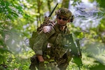 Staff Sgt. Austin Duck, a team lead in the Kentucky Air National Guard’s 123rd Explosive Ordnance Disposal flight, leads his team during a training exercise at Muscatatuck Urban Training Center in Butlerville, Ind., July 26, 2025. Duck was recently awarded the 2024 EOD Master Blaster award in the non-commissioned officer Category. (U.S. Air national Guard photo by Airman 1st Class Angelee Barnett)