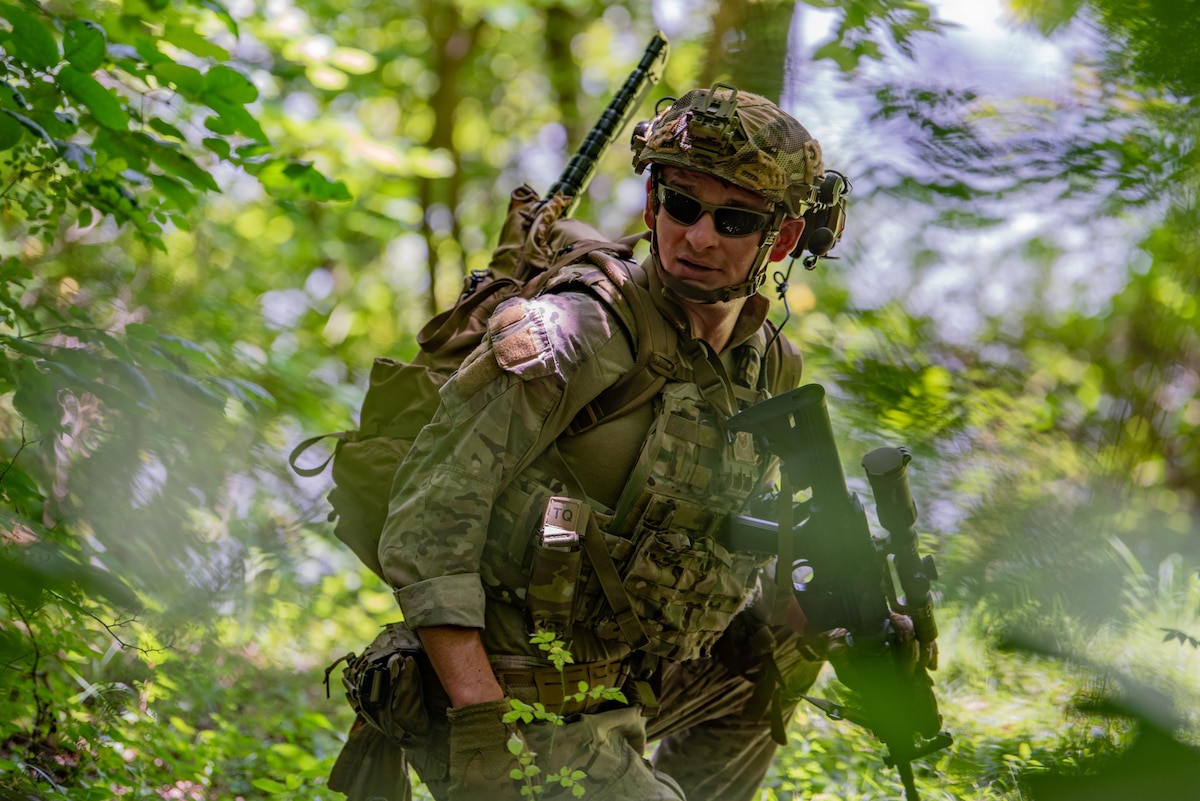 Staff Sgt. Austin Duck, a team lead in the Kentucky Air National Guard’s 123rd Explosive Ordnance Disposal flight, leads his team during a training exercise at Muscatatuck Urban Training Center in Butlerville, Ind., July 26, 2025. Duck was recently awarded the 2024 EOD Master Blaster award in the non-commissioned officer Category. (U.S. Air national Guard photo by Airman 1st Class Angelee Barnett)