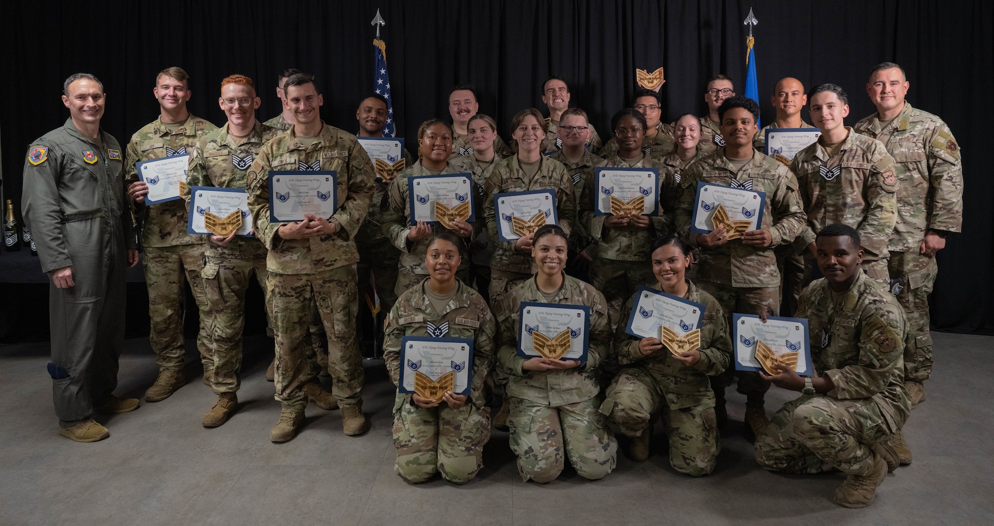 The 47th Flight Training Wing’s newest Staff Sgt. Selects pose for a group photo following their recognition ceremony at XL Landings, Aug. 18, 2025.  Air Force officials recently selected 15,894 Senior Airmen for promotion to Staff Sgt. out of 47,007 eligible candidates. (U.S. Air Force photo by Airman 1st Class Darryl Keith.)