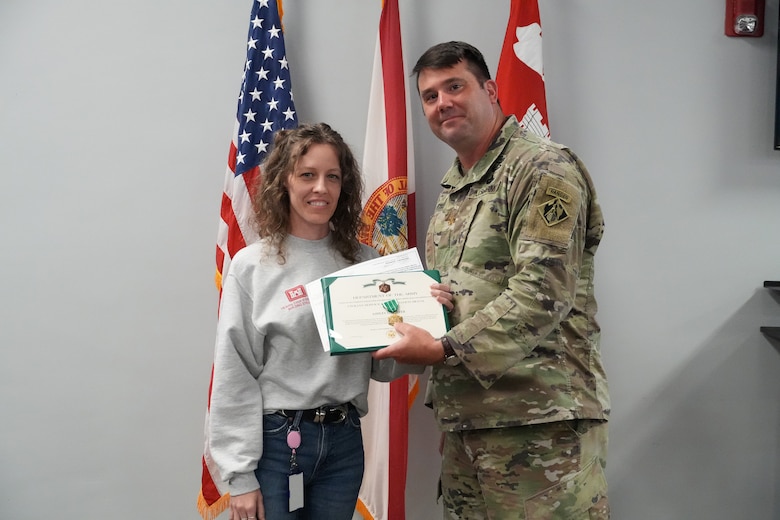 (Right) Ashley Foster, an Emergency Management Specialist with the Jacksonville District, talks with deployment members
Emergency Field Office during Hurricane Milton in Sarasota, Fla. Foster was recently named the 2024 USACE Emergency
Management Specialist of the Year.(USACE photo by Mark Rankin)