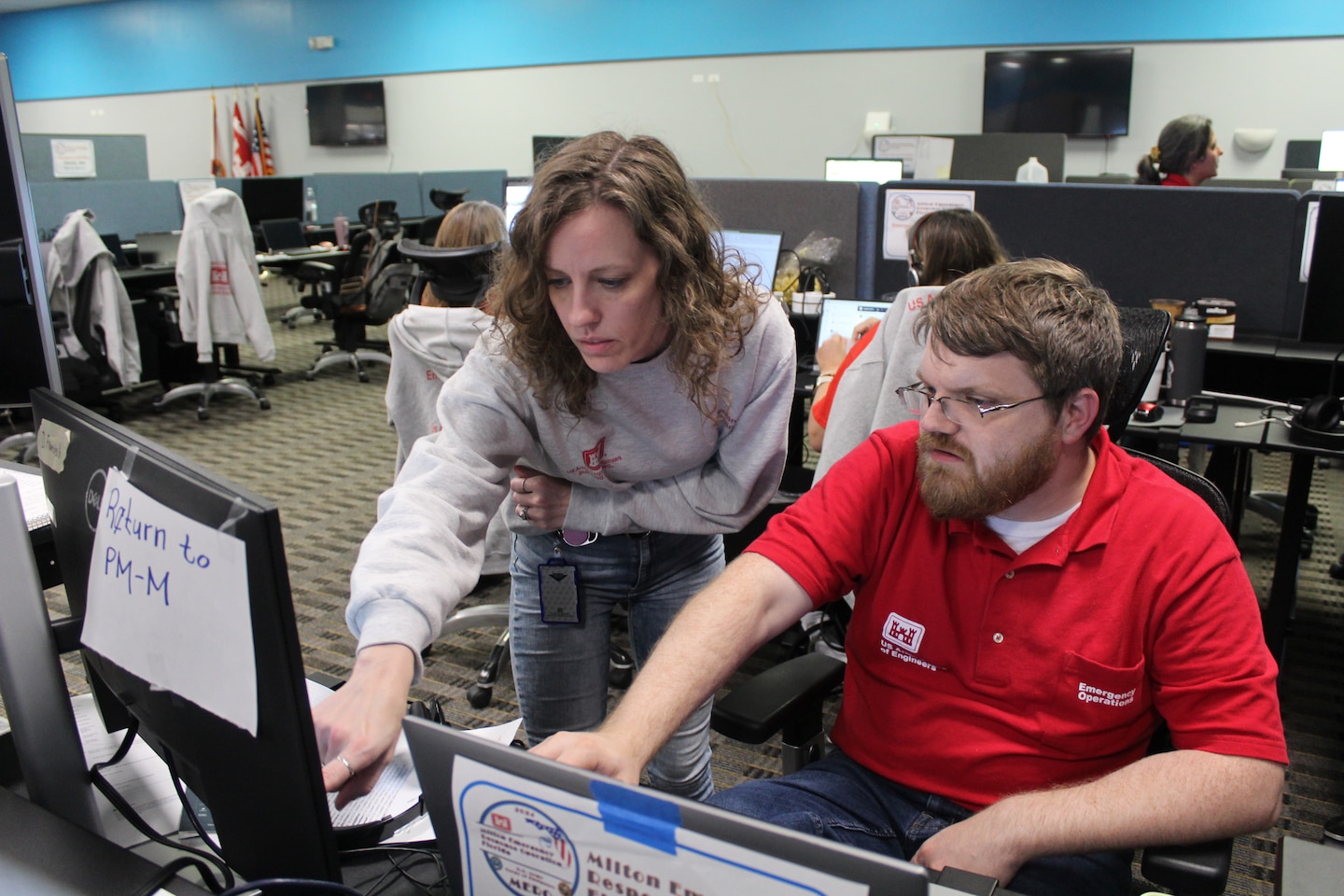 (Right) Ashley Foster, an Emergency Management Specialist with the Jacksonville District, talks with deployment members
Emergency Field Office during Hurricane Milton in Sarasota, Fla. Foster was recently named the 2024 USACE Emergency
Management Specialist of the Year.(USACE photo by Mark Rankin)