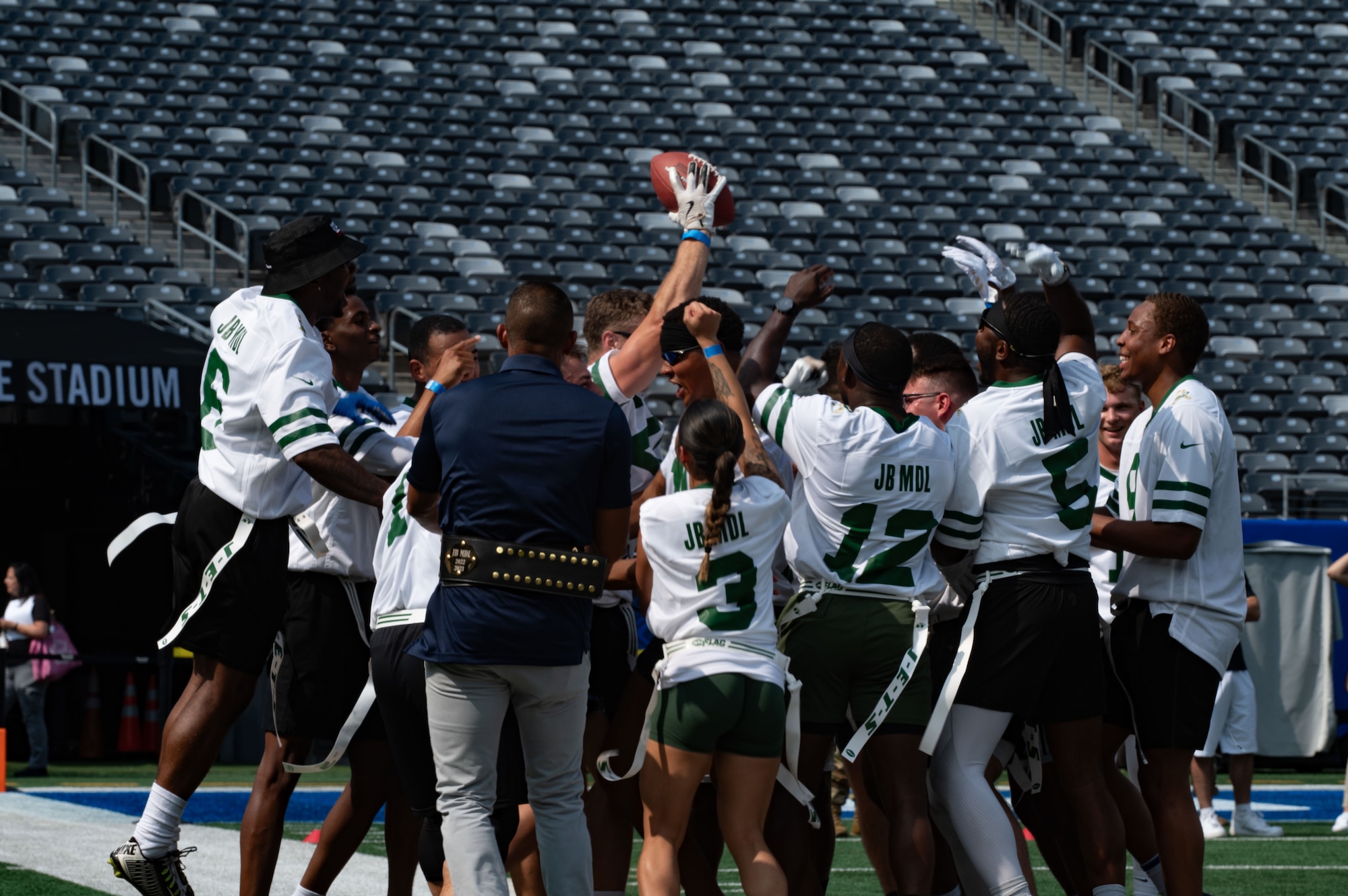 Service members from Joint Base McGuire-Dix-Lakehurst, N.J., celebrate the game-winning point against Fort Hamilton, N.Y., during the annual Salute to Service Bowl at MetLife Stadium, N.J., Aug. 16, 2025. Team JB MDL won the game for the fourth year in a row, with a score of 21-20.