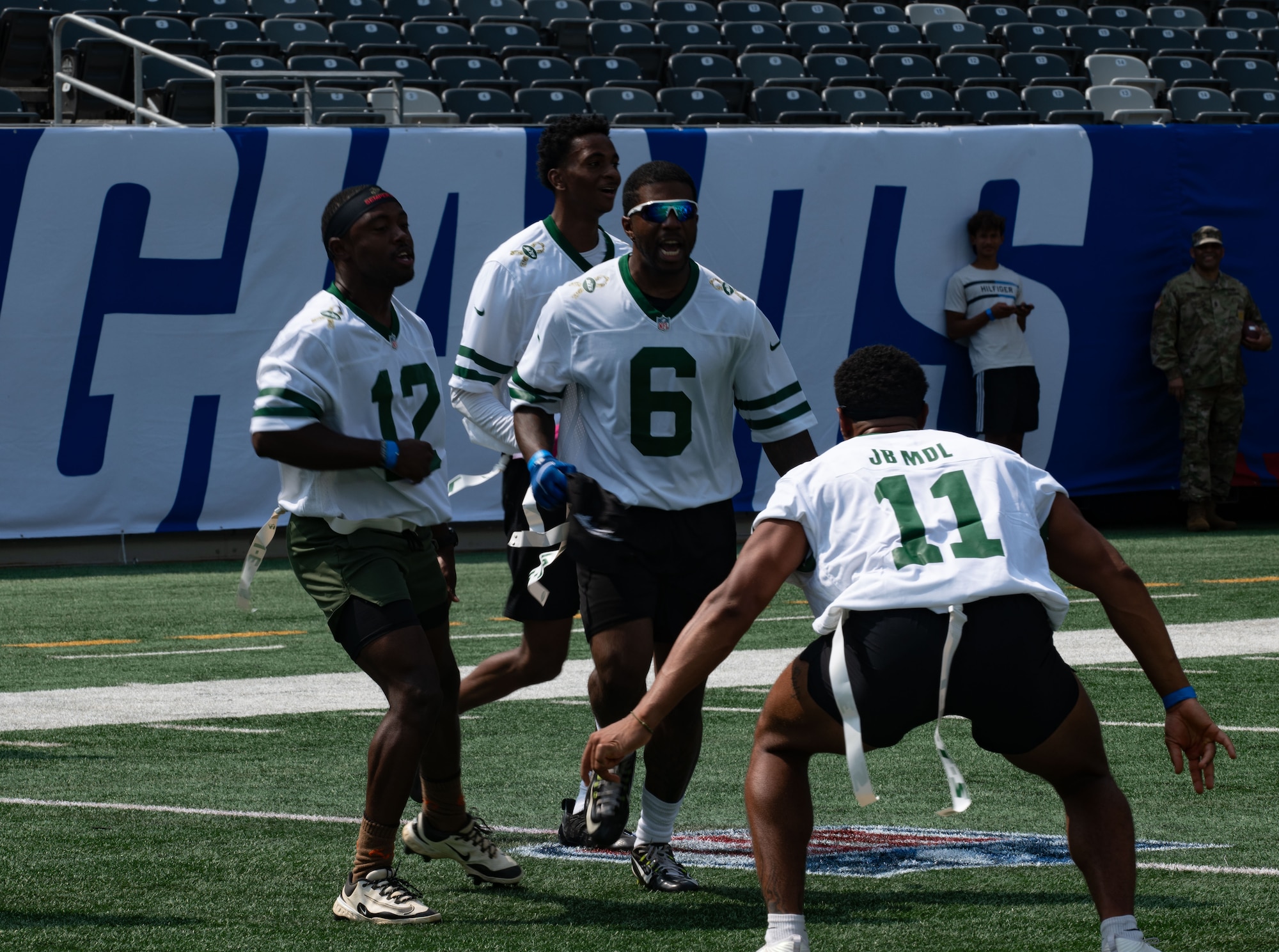 Service members from Joint Base McGuire-Dix-Lakehurst, N.J., celebrate after an interception during the Salute to Service Bowl at MetLife Stadium, N.J., Aug. 16, 2025. The Salute to Service Bowl occurs annually to honor service members from all branches of the armed forces.