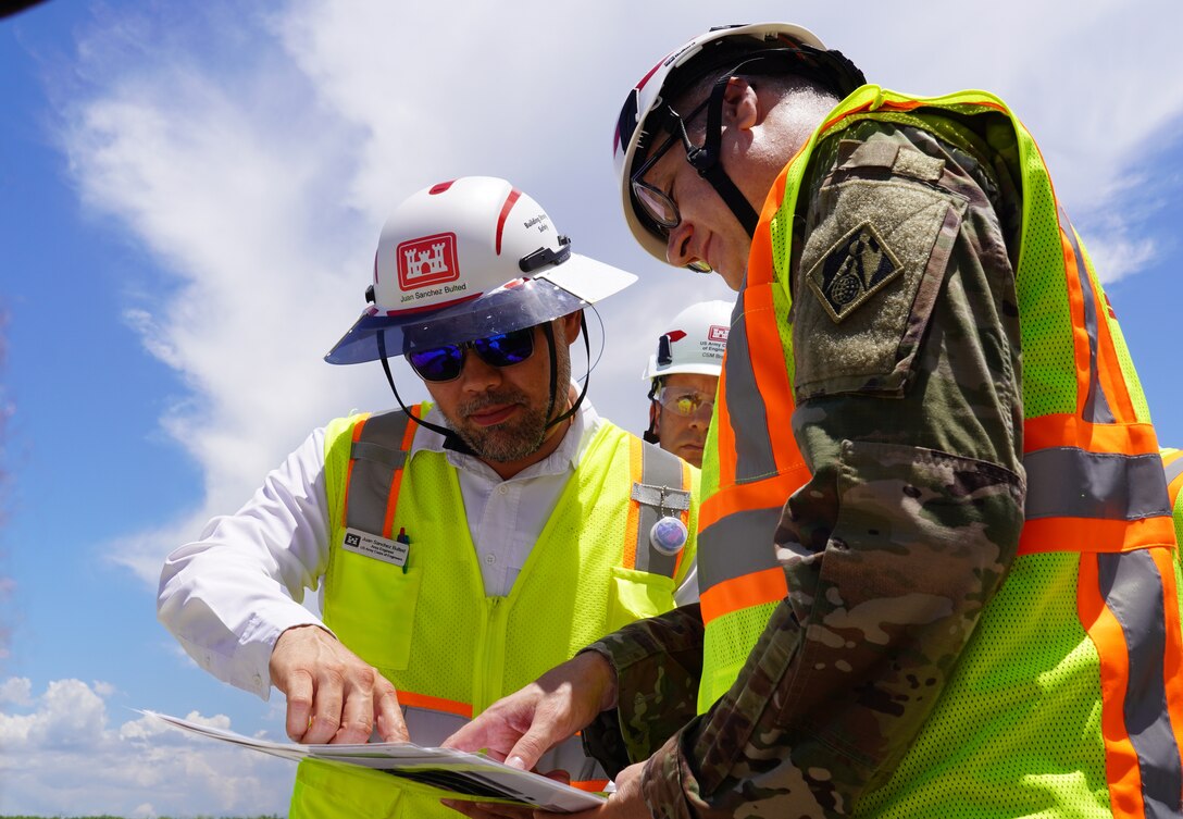Brig. Gen. Zachary Miller, U.S. Army Corps of Engineers South Atlantic Division commander gets a brief of the Everglades Agricultural Area project from Juan Sanchez Bulte, the Everglades Area engineer about equipment on site.  
(USACE photo by Mark Rankin)