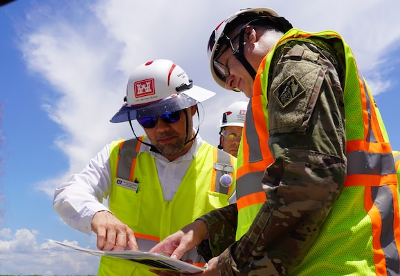 Brig. Gen. Zachary Miller, U.S. Army Corps of Engineers South Atlantic Division commander gets a brief of the Everglades Agricultural Area project from Juan Sanchez Bulte, the Everglades Area engineer about equipment on site.  
(USACE photo by Mark Rankin)