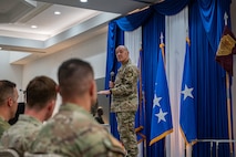 Airman at a ceremony posing for a photo.