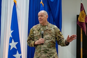 Airman at a ceremony posing for a photo.