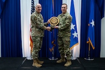 Airman at a ceremony posing for a photo.