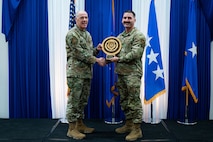 Airman at a ceremony posing for a photo.