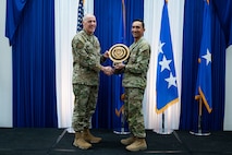 Airman at a ceremony posing for a photo.