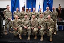 Airman at a ceremony posing for a photo.