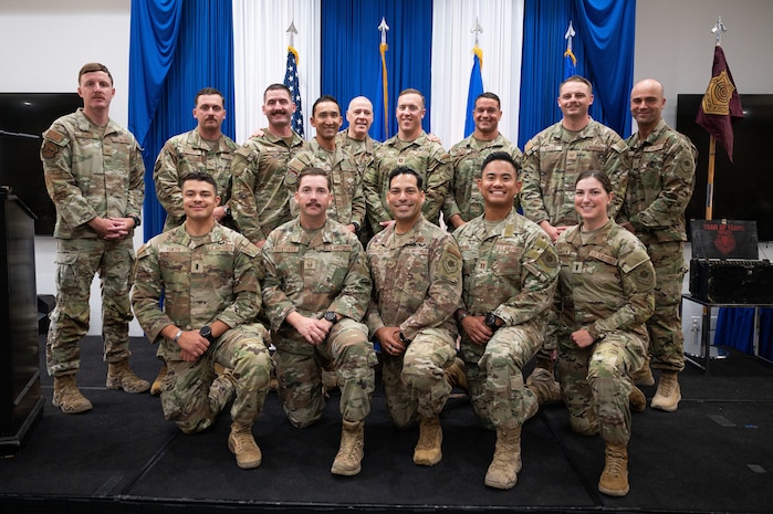 Airman at a ceremony posing for a photo.
