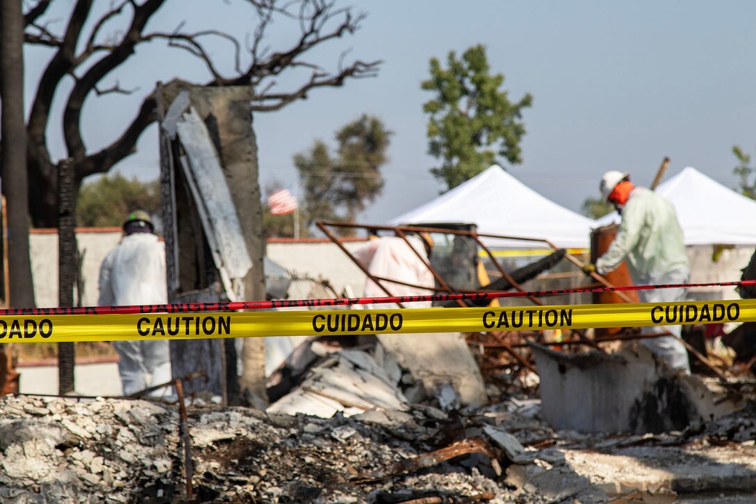A U.S. Army Corps of Engineers' contractor works on removing debris at the final private property assigned to USACE in the Eaton Fire's impact area Aug. 14 in Altadena, California.