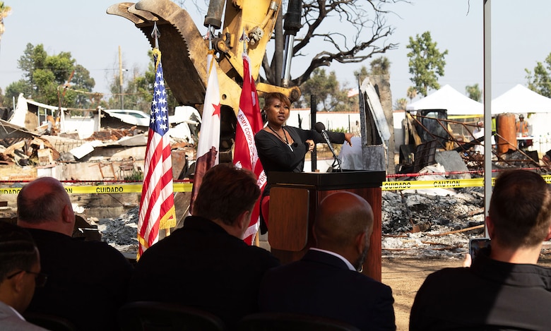 Altadena homeowner Tami Outterbridge speaks to the audience during a ceremony in honor of the beginning of the debris remoal for the last private property assigned to the U.S. Army Corps of Engineers that was impacted by the Eaton Fires during a ceremony Aug. 14 in Altadena, California. Tami and her mother, Beverly, are the owners of the property. (Photo by Dena O'Dell, USACE Los Angeles District Public Affairs)