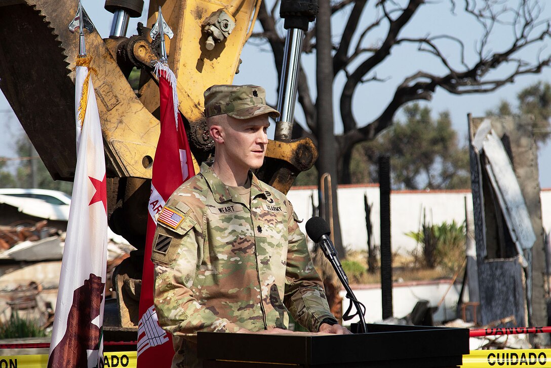 Lt. Col. David Weart, U.S. Army Corps of Engineers Eaton Area Recovery Field Office commander, speaks to the crowd during an Aug. 14 ceremony in honor of the beginning of the debris removal at the past private property assigned to USACE that was impacted by the Eaton Fires in Altadena, California.