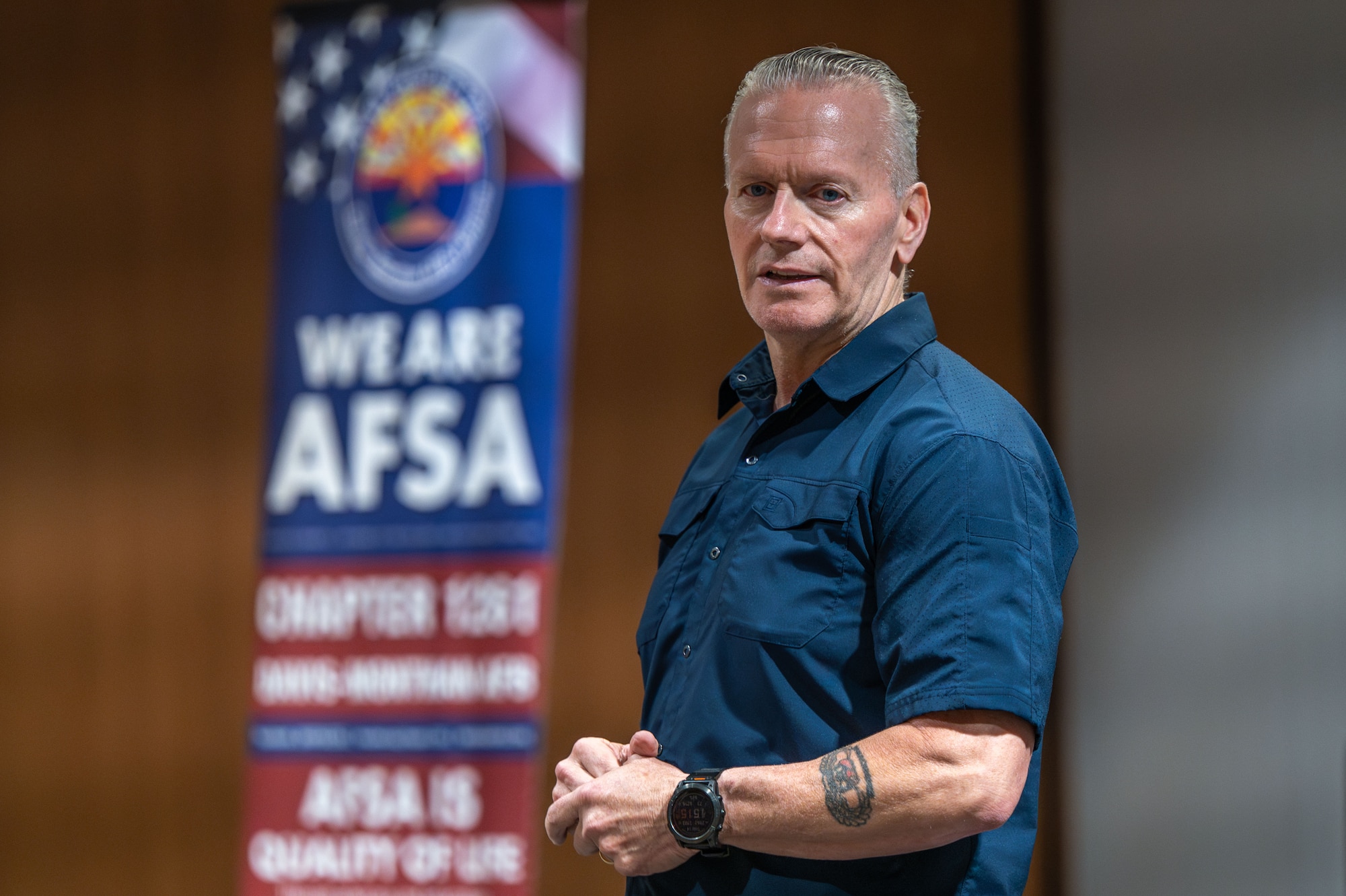 U.S. Army retired Command Sgt. Maj. John Wayne Troxell, 3rd Senior Enlisted Advisor to the Chairman of the Joint Chiefs of Staff, speaks on his experience and knowledge of leadership to Airmen at Davis-Monthan Air Force Base, Arizona, Aug. 14, 2025. Troxell offered leadership insight and shared anecdotes with the goal of attendees walking away a better Airman. (U.S. Air Force photo by Senior Airman Jasmyne Bridgers-Matos)