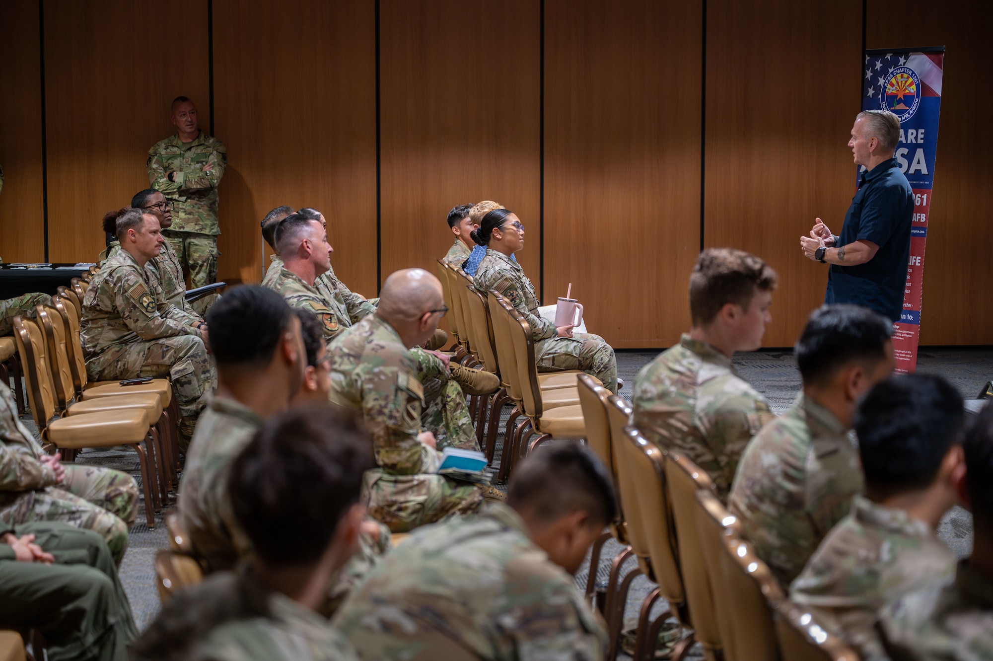 U.S. Army retired Command Sgt. Maj. John Wayne Troxell, 3rd Senior Enlisted Advisor to the Chairman of the Joint Chiefs of Staff, speaks on his experience and knowledge of leadership to Airmen at Davis-Monthan Air Force Base, Arizona, Aug. 14, 2025. Troxell shared his experiences and the significance of having difficult conversations. (U.S. Air Force photo by Senior Airman Jasmyne Bridgers-Matos)