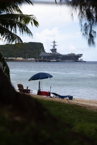 APRA HARBOR, Guam (Aug. 17, 2025) Nimitz-class aircraft carrier USS George Washington (CVN 73) arrives in Guam for a scheduled port visit, Aug. 17. George Washington is the U.S. Navy’s premier forward-deployed aircraft carrier, a long-standing symbol of the United States’ commitment to maintaining a free and open Indo-Pacific region, operating alongside allies and partners across the U.S. 7th Fleet area of responsibility. (U.S. Navy photo by Lt. Cmdr. Michelle Tucker)