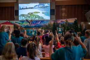 Children and volunteers dance and listen to music during Vacation Bible School held by the Yokota Chapel at Yokota Air Base, Japan.