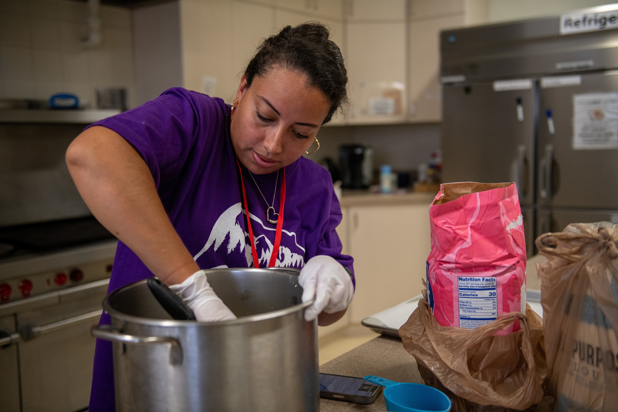 A volunteer prepares food ingredients for students during vacation bible school at Yokota Air Base, Japan.