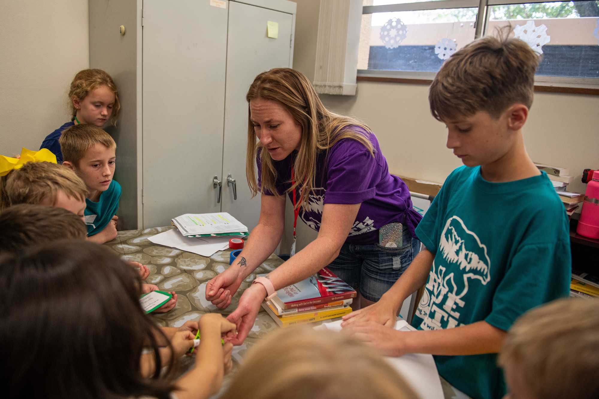 Students and volunteers engage in an activity during Vacation Bible School held by the Yokota Chapel at Yokota Air Base, Japan