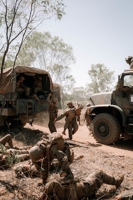 U.S. Marines and Navy Hospital Corpsmen with Combat Logistics Battalion 1, Marine Rotational Force – Darwin 25.3, remove simulated casualties from a 7-ton truck while conducting a mass casualty drill during Talisman Sabre 25, in the Northern Territory, Australia, July 21, 2025.
