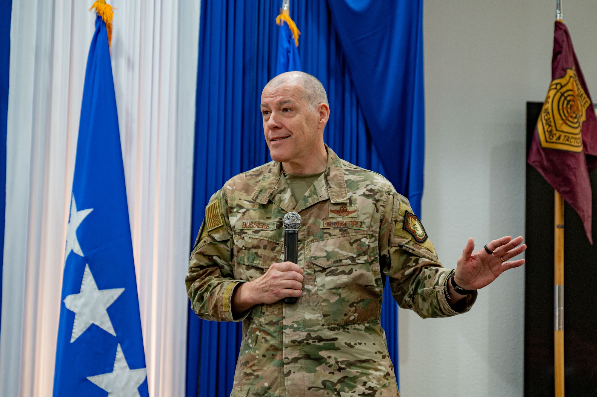Airman at a ceremony posing for a photo.