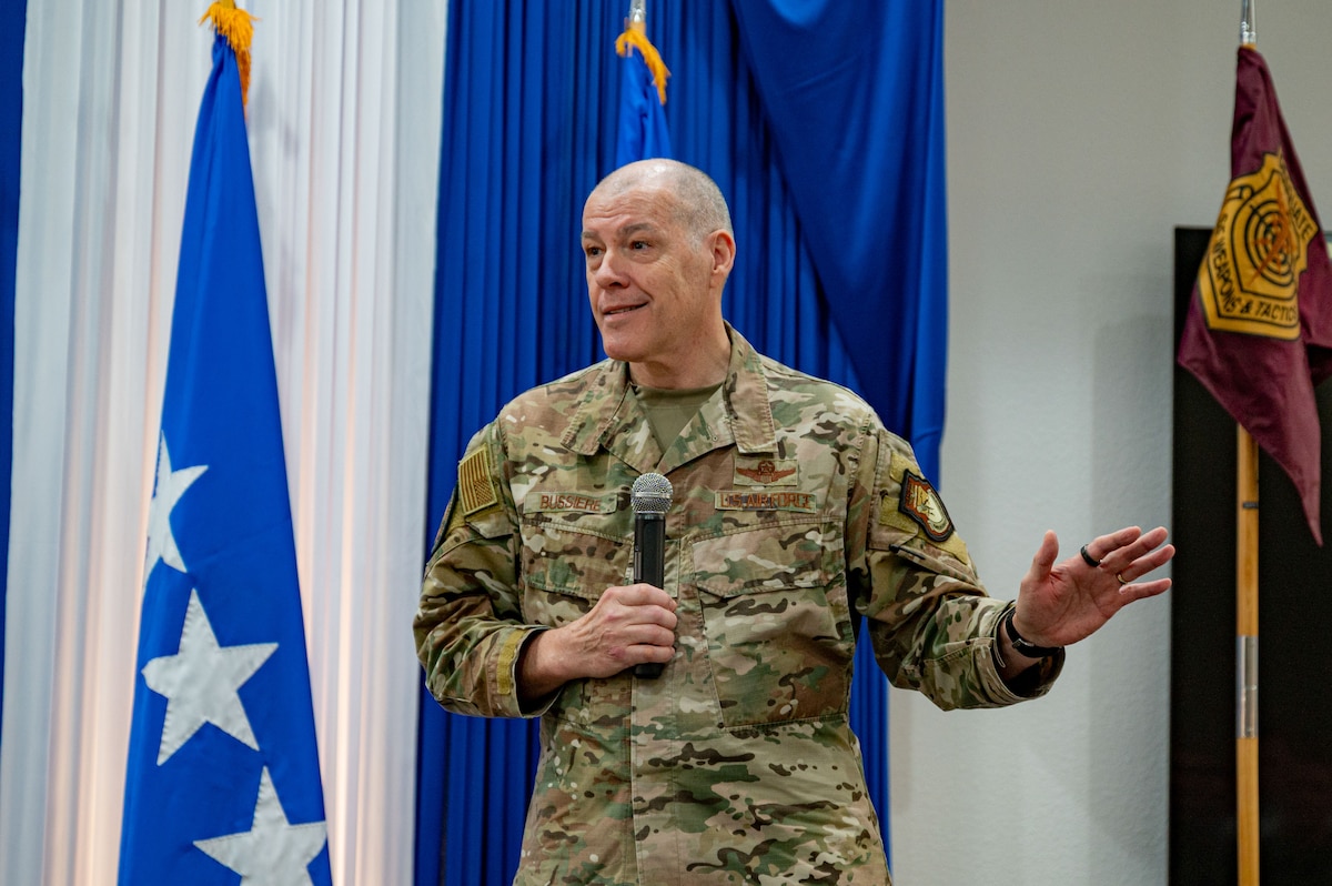Airman at a ceremony posing for a photo.