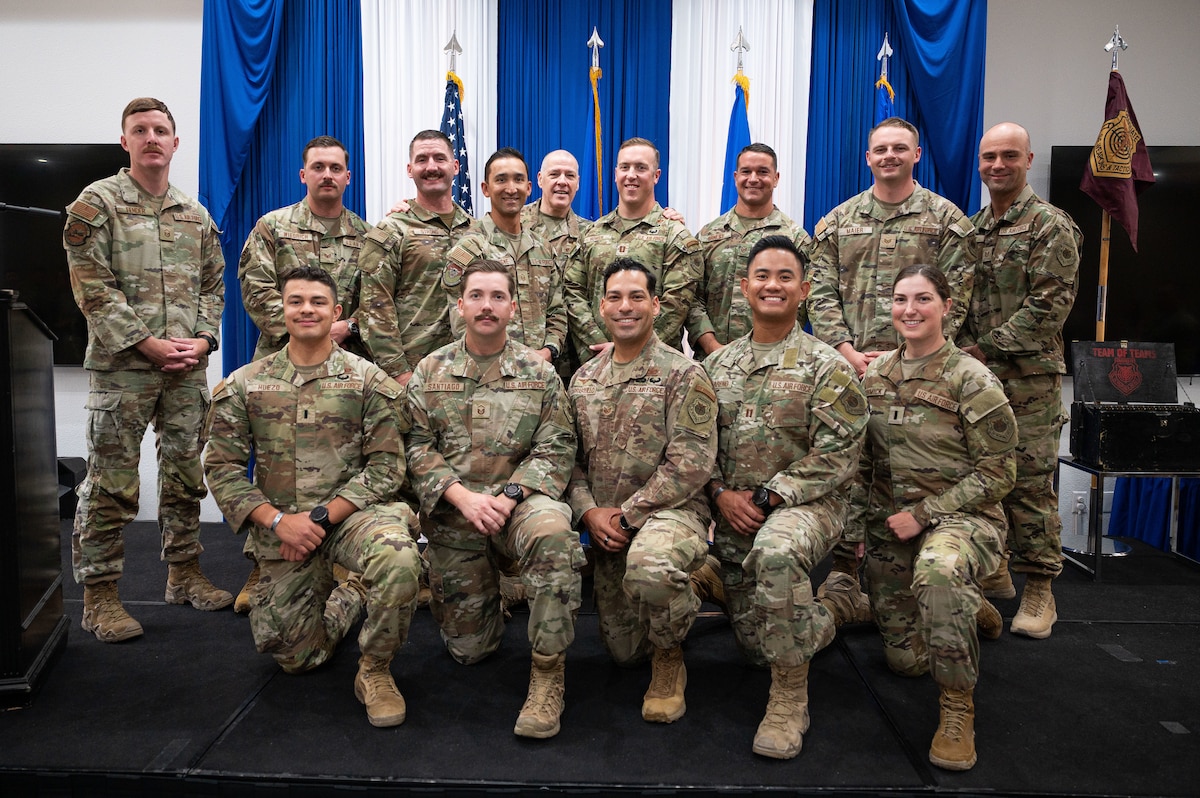 Airman at a ceremony posing for a photo.